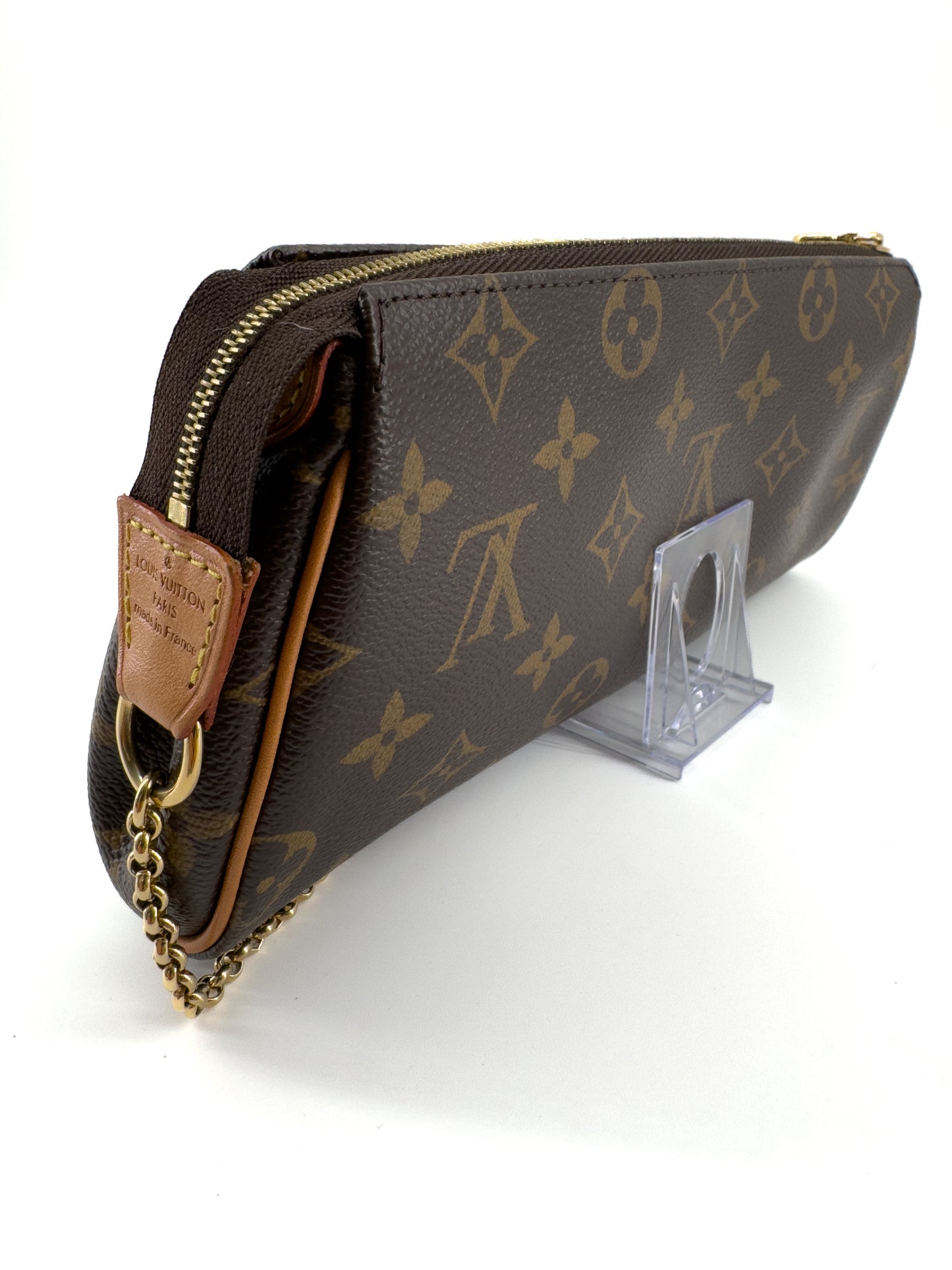 LOUIS VUITTON EVA MONOGRAM – Pochette en toile enduite avec chaîne dorée et bandoulière cuir