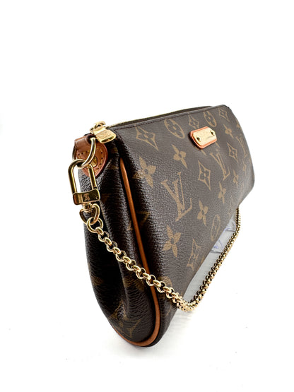 LOUIS VUITTON EVA MONOGRAM – Pochette en toile enduite avec chaîne dorée et bandoulière cuir